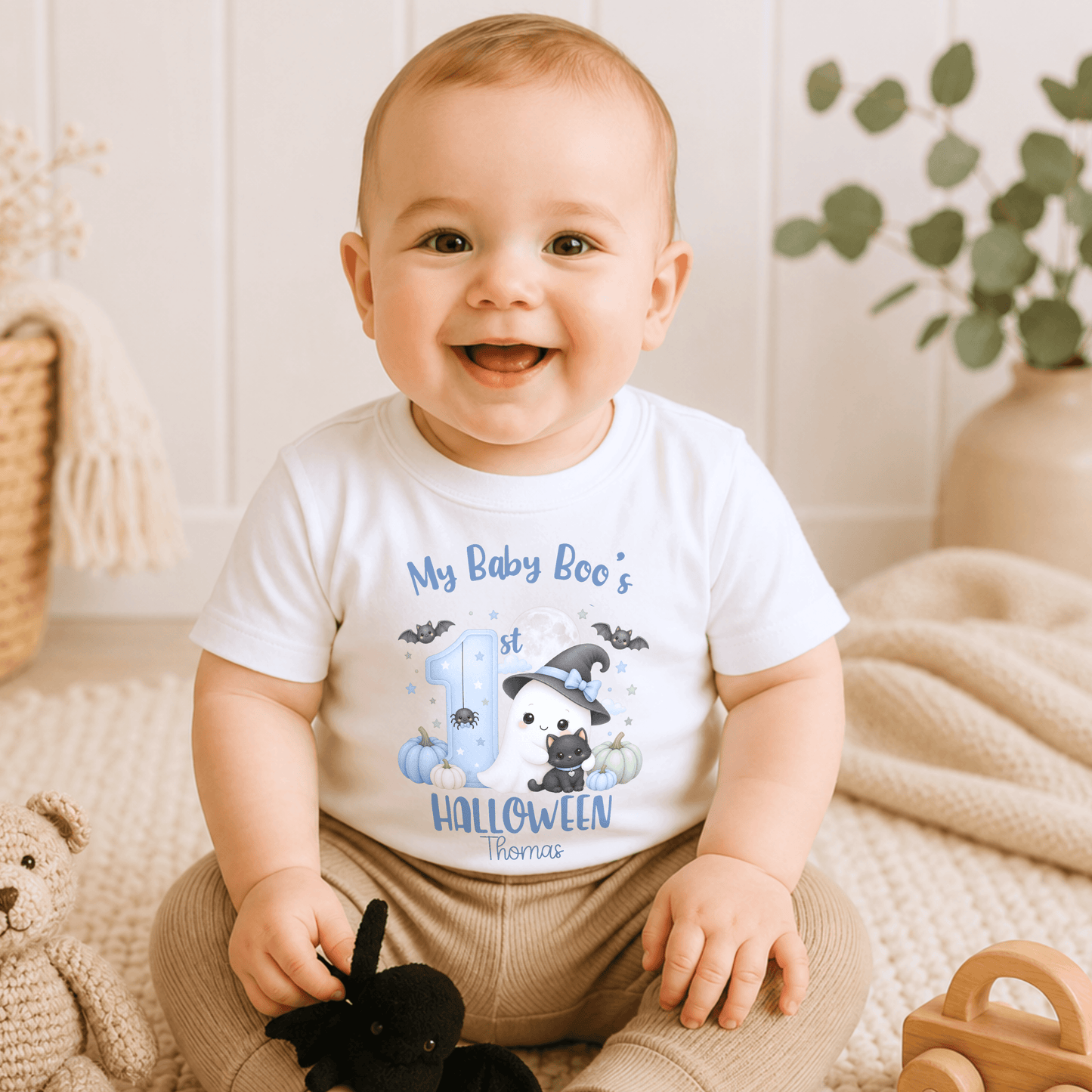 Personalised First Halloween Baby Outfit for boys featuring a cute Baby Boo ghost, black cat, pumpkins, bats and personalised 1st Halloween design.