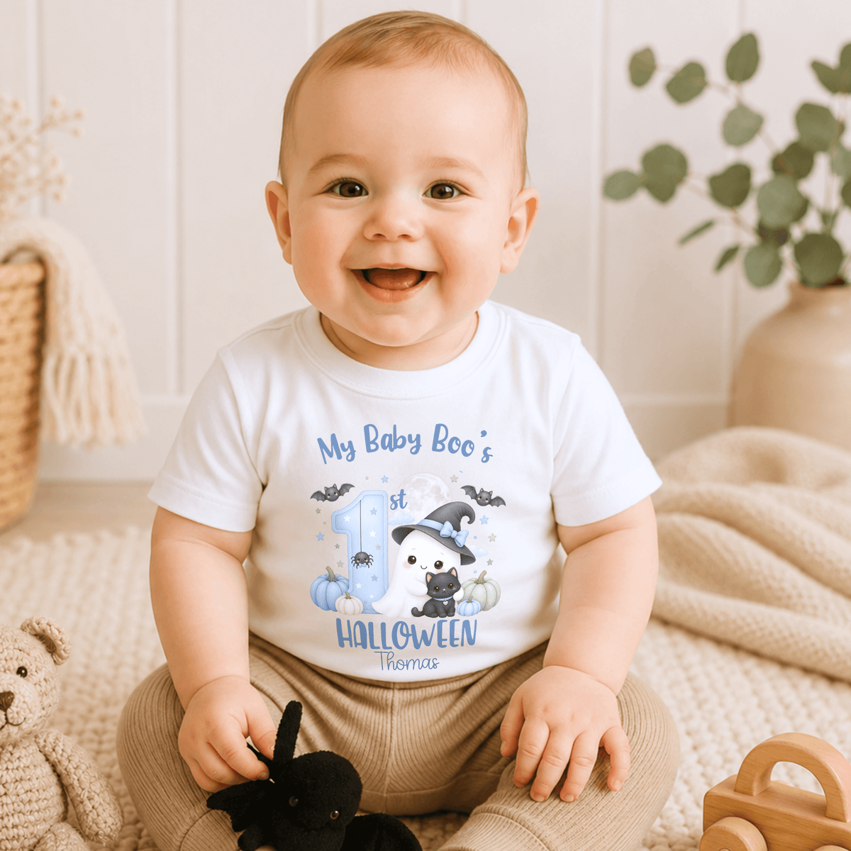 Personalised First Halloween Baby Outfit for boys featuring a cute Baby Boo ghost, black cat, pumpkins, bats and personalised 1st Halloween design.