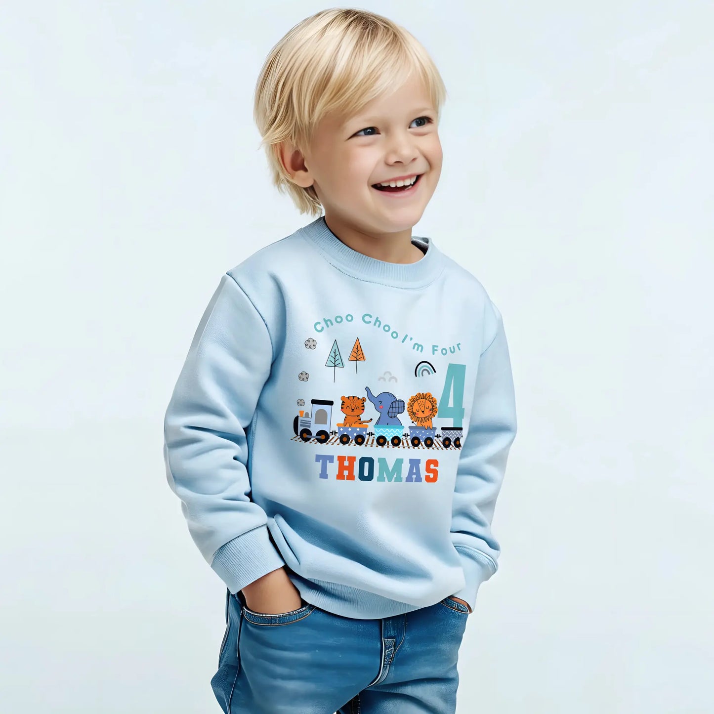 Safari birthday sweatshirt, White cotton t-shirt featuring a vibrant safari jungle theme designed for a boy's birthday party. The top is personalised with the phrase ‘Choo Choo I'm Two,’ or any age, and adorned with playful illustrations of jungle animals like lions, elephants, and giraffes, perfect for a safari-themed celebration. Also for boys that love trains. Boys toddler birthday shirt, personalised toddler gift ideas, jungle animal themed birthday party ideas.