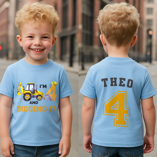 Excavator Digger Birthday T-Shirt: This white t-shirt features a vibrant yellow excavator graphic alongside the playful text “I am digging it,” with customizable age options to celebrate a birthday. The back is personalised with the boy name and age in bold yellow with a black outline. Ideal as a gift for a boy or toddler birthday or a construction-themed party.