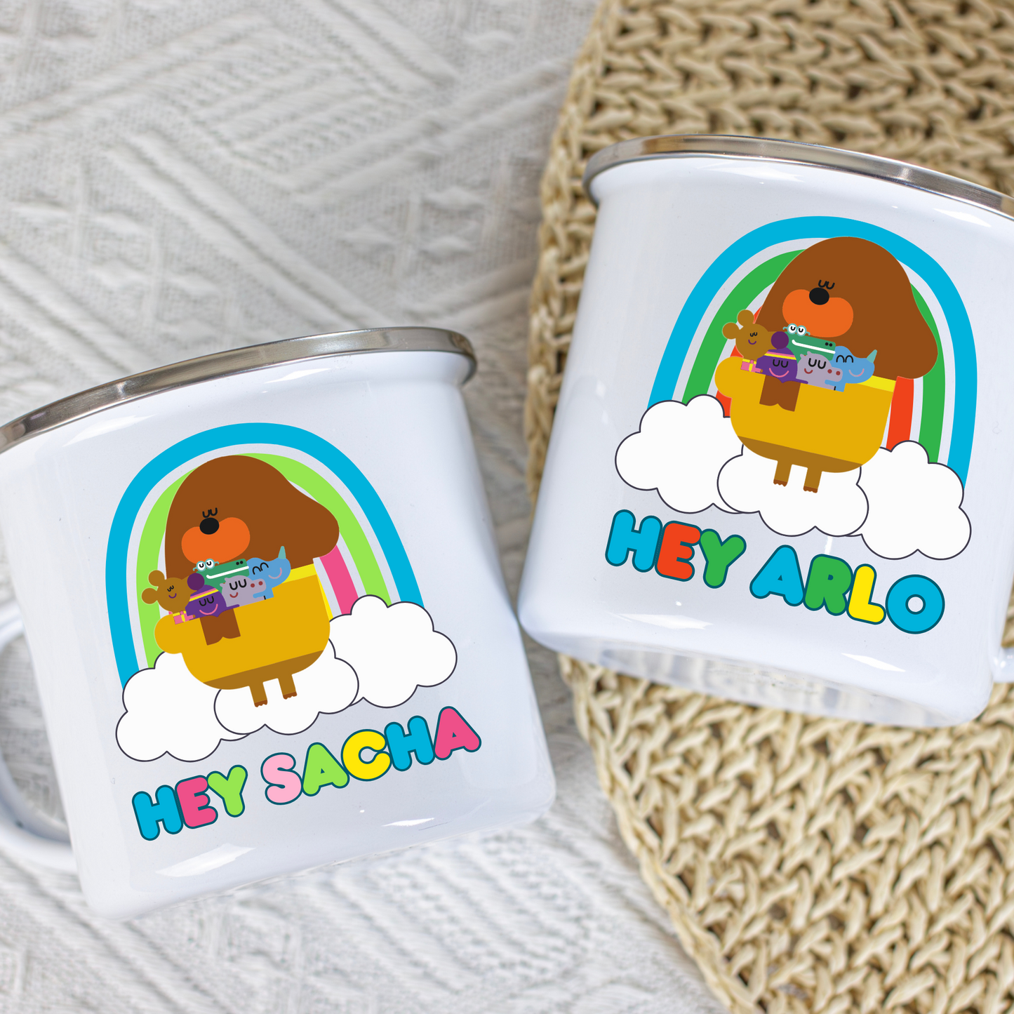 Hey Duggee Enamel Mug: Two white kid cups with a Hey Duggee design and personalized names on a textured surface. Perfect for a toddler birthday gift, christmas gift