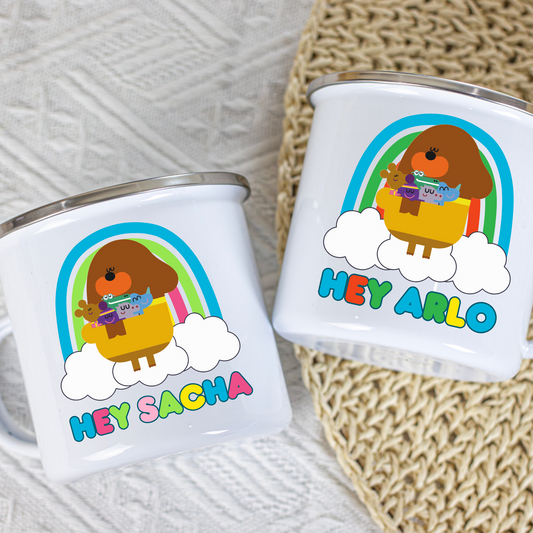 Hey Duggee Enamel Mug: Two white kid cups with a Hey Duggee design and personalized names on a textured surface. Perfect for a toddler birthday gift, christmas gift
