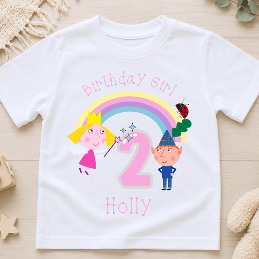 Personalised Ben and Holly Birthday T-Shirt for girls with name, age, rainbow, fairy and elf birthday design, available in pink, white and black.