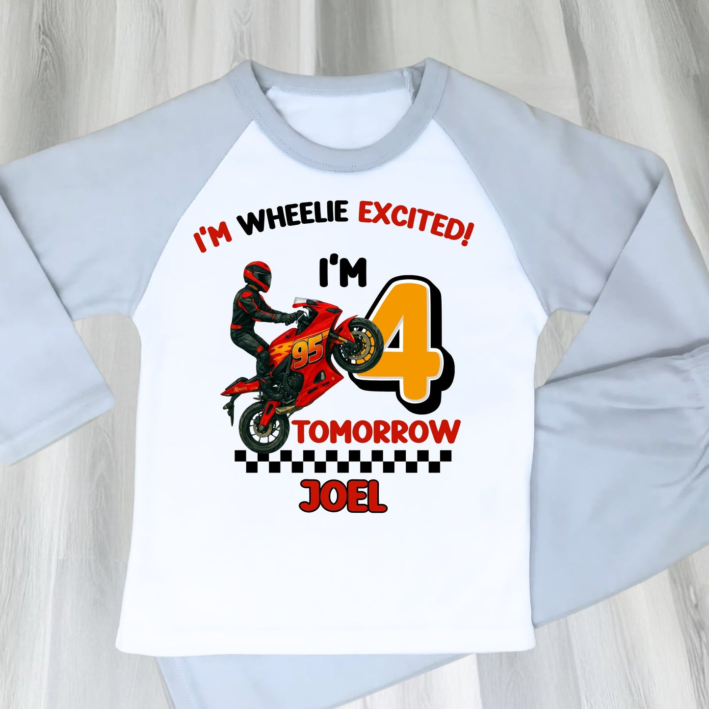 Personalised motorbike birthday pyjamas with Lightning-McQueen-inspired design and custom name and age