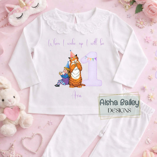 Personalised girls The Tiger Who Came For Tea birthday pyjamas with child’s name and age, featuring storybook tiger illustration and purple number design on soft cotton set.