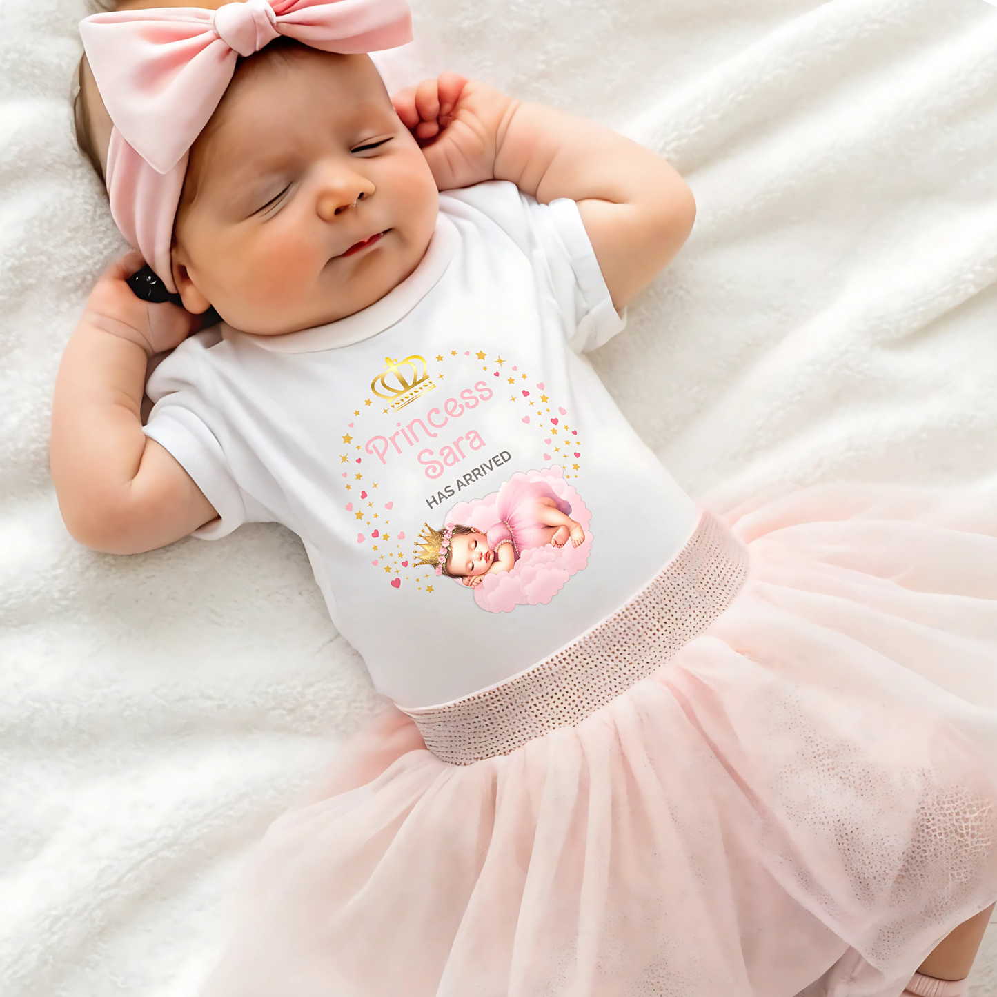 Personalised baby outfit: A collection of vibrant and charming baby clothes, featuring sleepsuits, bodysuits, T-shirts, and bibs, all designed for baby girls. The items are part of the “Personalised Baby Girls The Princess Has Arrived” collection.. The collection allows for customisation with a baby’s name, making these pieces ideal for gifts or special occasions. This will make a great newborn baby gift for gender reveal, baby shower, or to welcome a new baby coming home outfit.