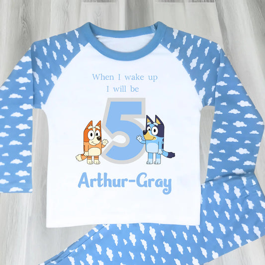 Bluey birthday pyjamas: Personalised Bluey and Bingo birthday pujamas featuring vibrant prints of the beloved characters and a number to indicate the child's age. These delightful pyjamas, complete with the child's name, make bedtime an exciting continuation of the birthday festivities. Perfect for creating cherished birthday traditions and adding joy to the special day. Bluey pyjamas, Bingo pyjamas, birthday pyjamas, personalised children's pyjamas, birthday celebration, bedtime fun, toddler birthday