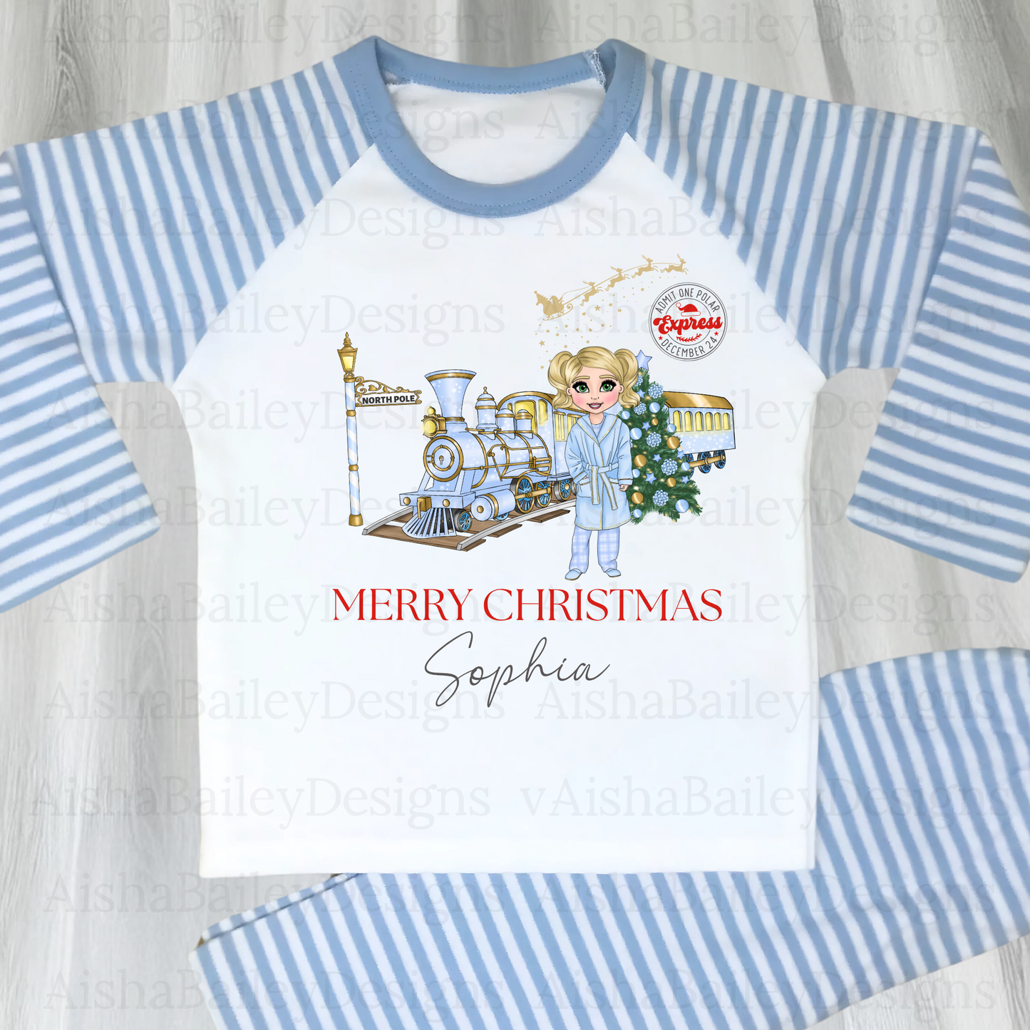 Polar Express Christmas Pyjamas: A set of Polar Express Christmas pyjamas for children, featuring a festive design with a Christmas train and the message "Merry Christmas." The pyjamas are customizable, allowing for personalization of the doll's hair color, skin tone, and eye color to reflect the child's unique features, creating a special, memorable keepsake.