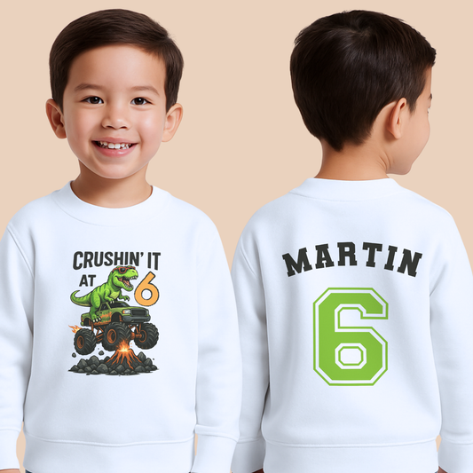 Personalised boys dinosaur birthday sweatshirt with T-Rex monster truck and custom name and age back print