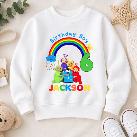 Personalised Boys Teletubbies Birthday Sweatshirt with rainbow design, custom name and age, available in white, blue and green.