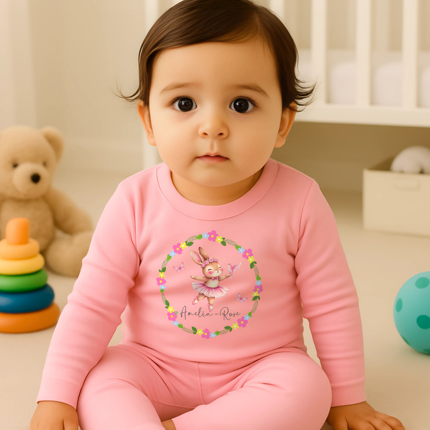 Personalised baby pyjamas: A set of personalised baby girl clothes featuring a dusky pink ballet bunny surrounded by a floral wreath. The pyjamas are designed for ages 0-2 years and includes flower-themed pyjamas. It can be customised with a name, making it a thoughtful new baby gift: Personalised Baby Girls Dusky Pink Ballet Bunny Floral Wreath 0-2 Years, New Baby Gift with Name, Flower Pyjamas, Custom Baby Girl Clothes
