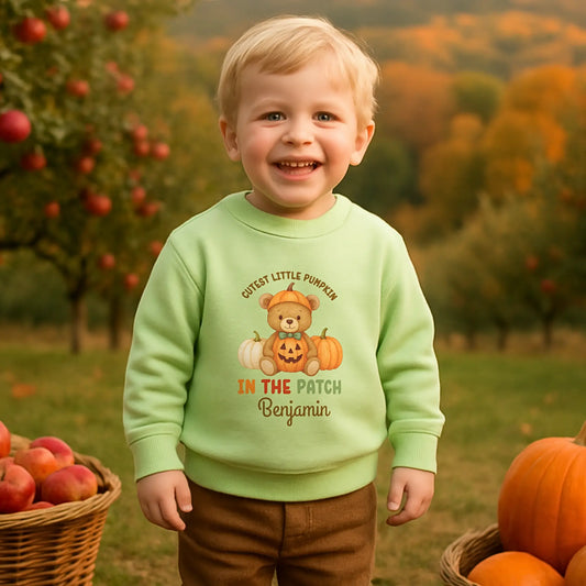 Personalised Halloween sweatshirt for kids with teddy bear and “Cutest Pumpkin in the Patch” design.