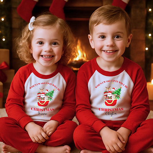 Personalised Christmas pyjamas with Father Christmas sleigh design for boys and girls, When uI wake up it will be Christmas