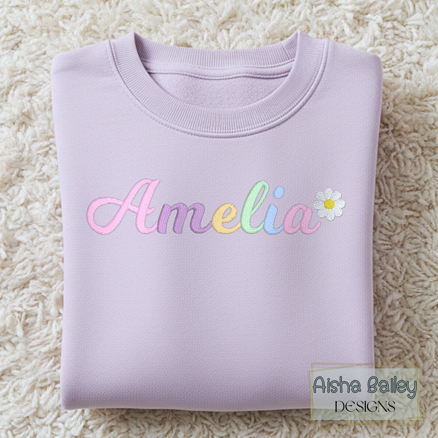 Girls personalised embroidered sweatshirt with custom name and pastal colours and daisy