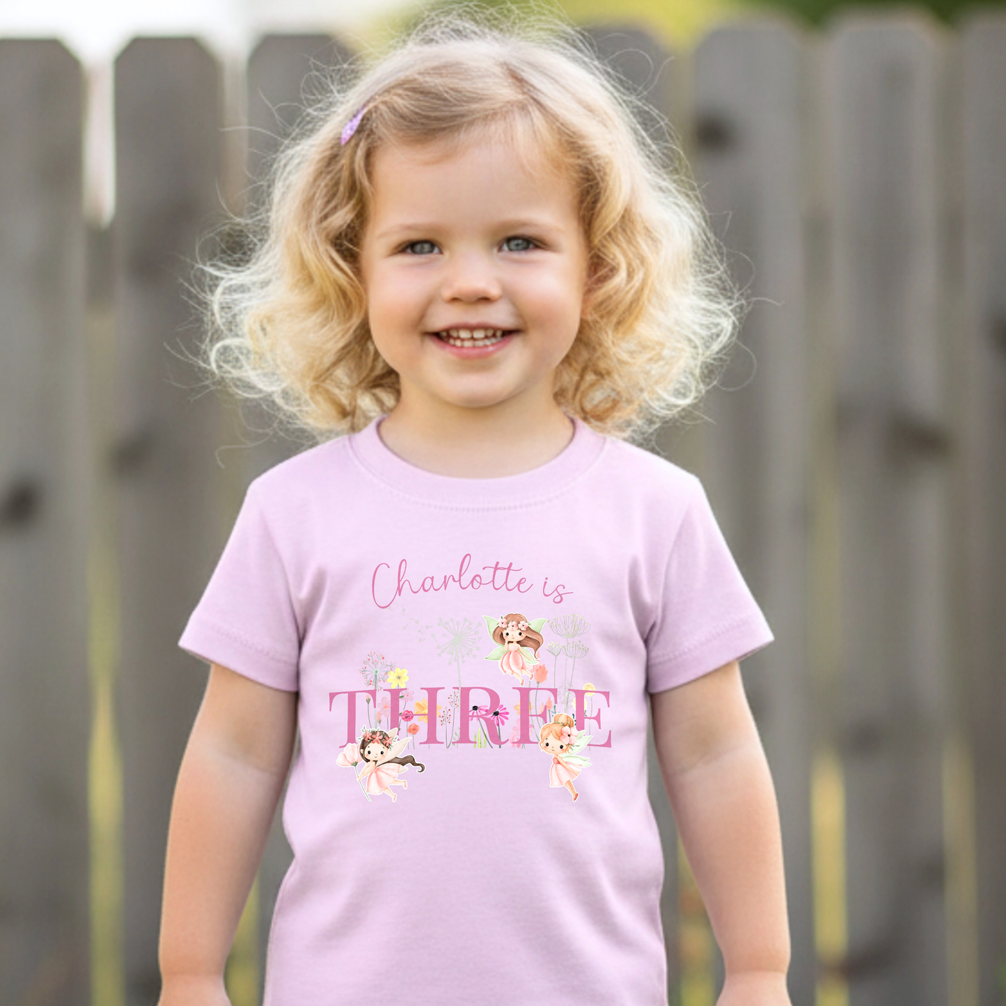 Personalised fairy birthday outfit for girls featuring custom name, chosen age, fairy garden artwork and floral design, perfect for birthday celebrations and photoshoots.