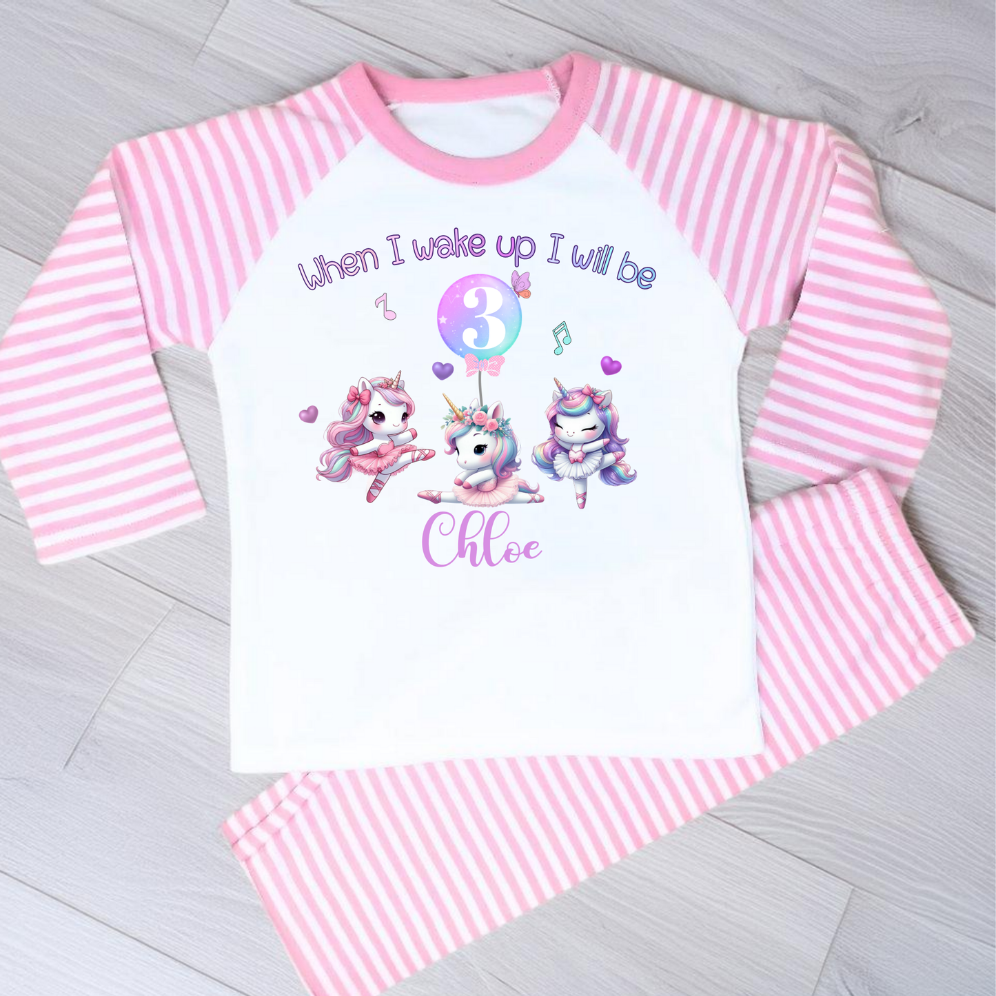 An adorable set of pastel pink and lilac birthday pyjamas, featuring a whimsical dancing unicorn design. Perfect for little girls who love unicorns, this personalised ‘When I Wake Up’ toddler set makes a magical gift for your little dancer. Personalised Birthday pyjamas, girls birthday gift, birthday outfit, unicorn present, personalised unicorn birthday ideas, uncicorn birthday party ideas