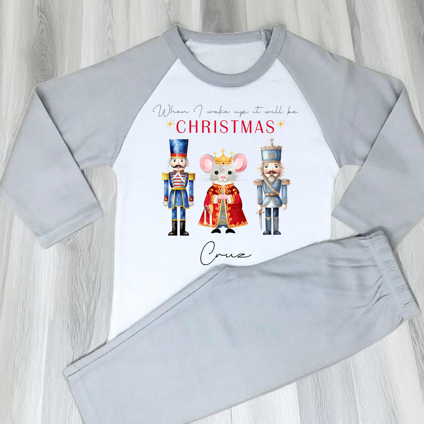 Nutcracker christmas pyjamas, A set of personalised boys Nutcracker-themed Christmas pyjamas, featuring the festive phrase “When I Wake Up It Will Be Christmas.” These cosy christmas pyjamas are adorned with whimsical Nutcracker illustrations, perfect for adding a touch of magic to a child's Christmas Eve: personalized, boys, Nutcracker, Christmas pyjamas, festive, holiday, cosy, magical.