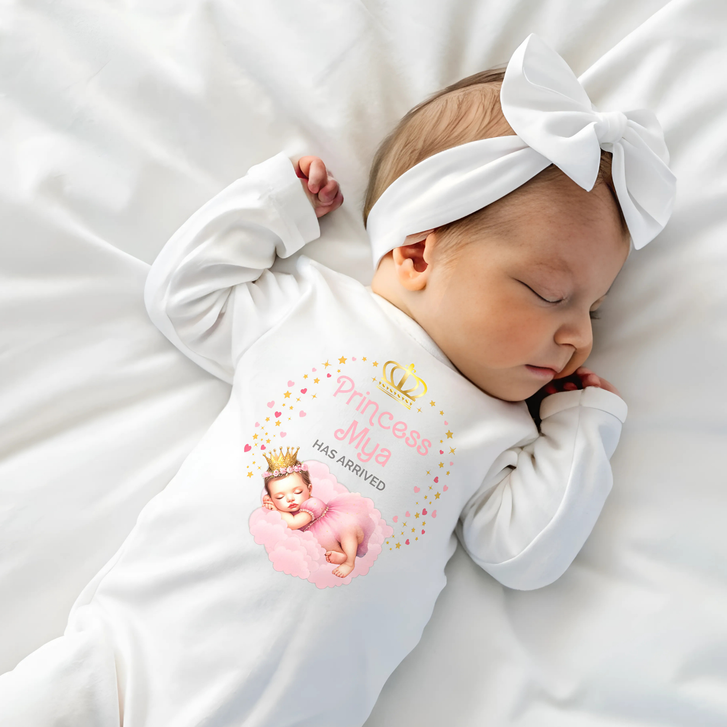 Personalised baby outfit: A collection of vibrant and charming baby clothes, featuring sleepsuits, bodysuits, T-shirts, and bibs, all designed for baby girls. The items are part of the “Personalised Baby Girls The Princess Has Arrived” collection.. The collection allows for customisation with a baby’s name, making these pieces ideal for gifts or special occasions. This will make a great newborn baby gift for gender reveal, baby shower, or to welcome a new baby coming home outfit.