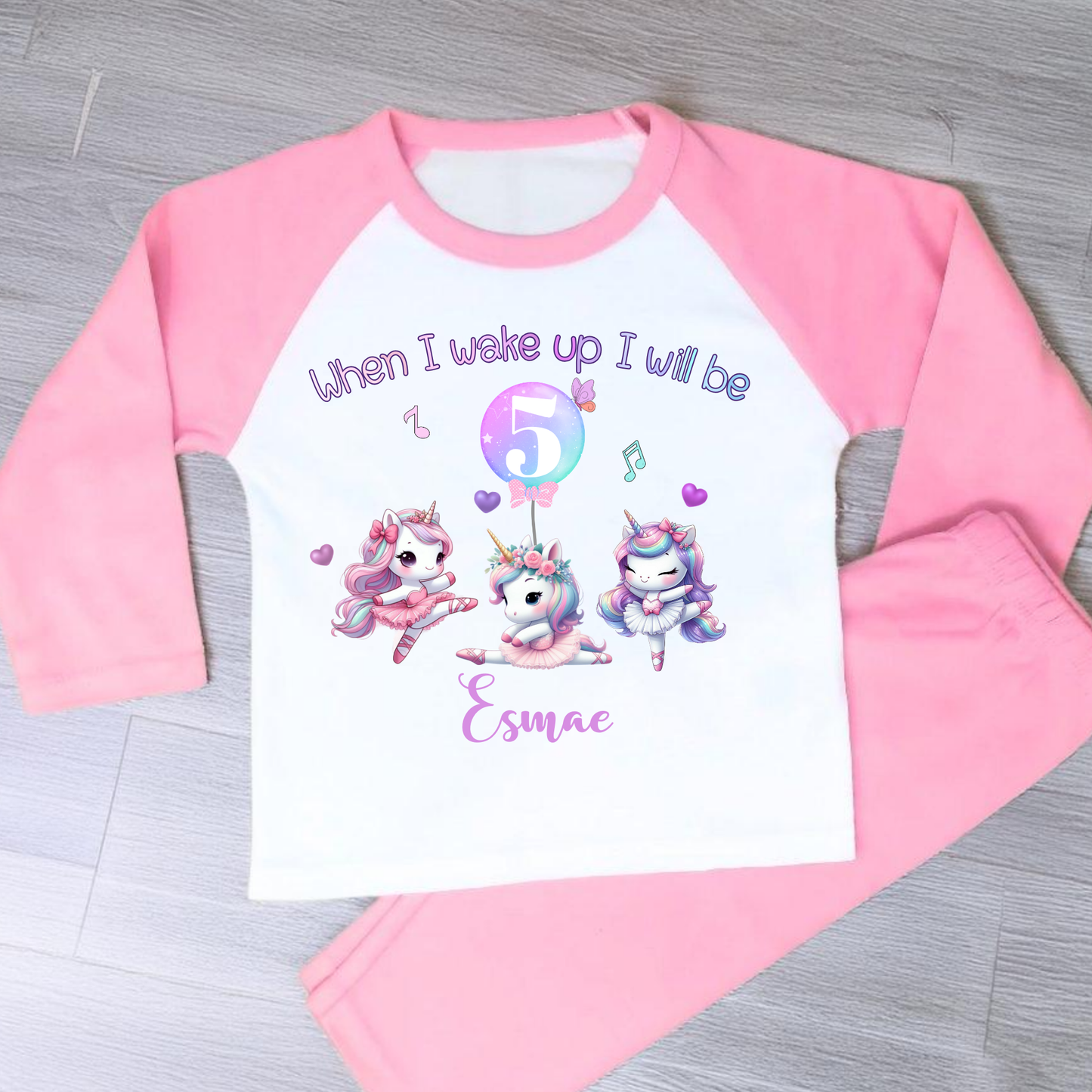 An adorable set of pastel pink and lilac birthday pyjamas, featuring a whimsical dancing unicorn design. Perfect for little girls who love unicorns, this personalised ‘When I Wake Up’ toddler set makes a magical gift for your little dancer. Personalised Birthday pyjamas, girls birthday gift, birthday outfit, unicorn present, personalised unicorn birthday ideas, uncicorn birthday party ideas