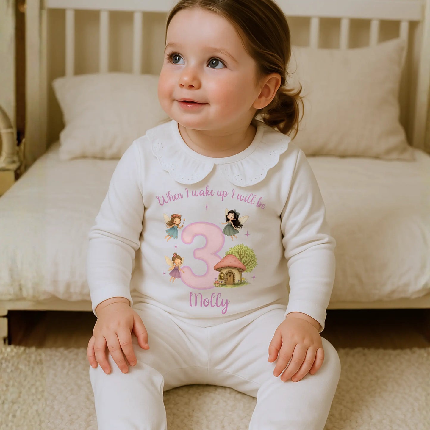 Fairy birthday pyjamas for girls featuring pastel fairy artwork, stars, and custom name and age for a magical personalised birthday outfit.