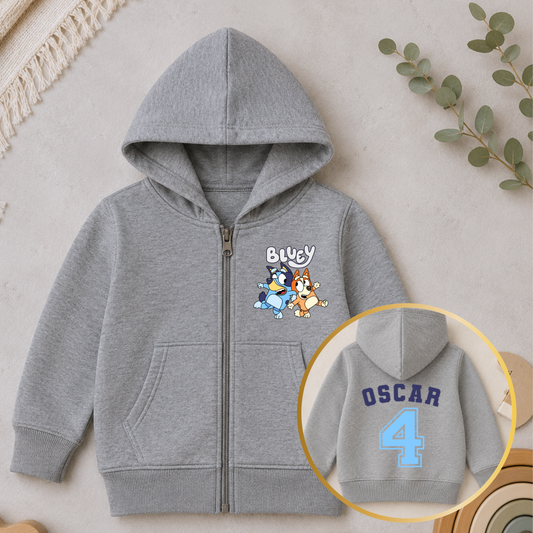 Personalised Boys Birthday Hoodie featuring Bluey and Bingo on the front, with your child's name and birthday age in a fun varsity-style design on the back.