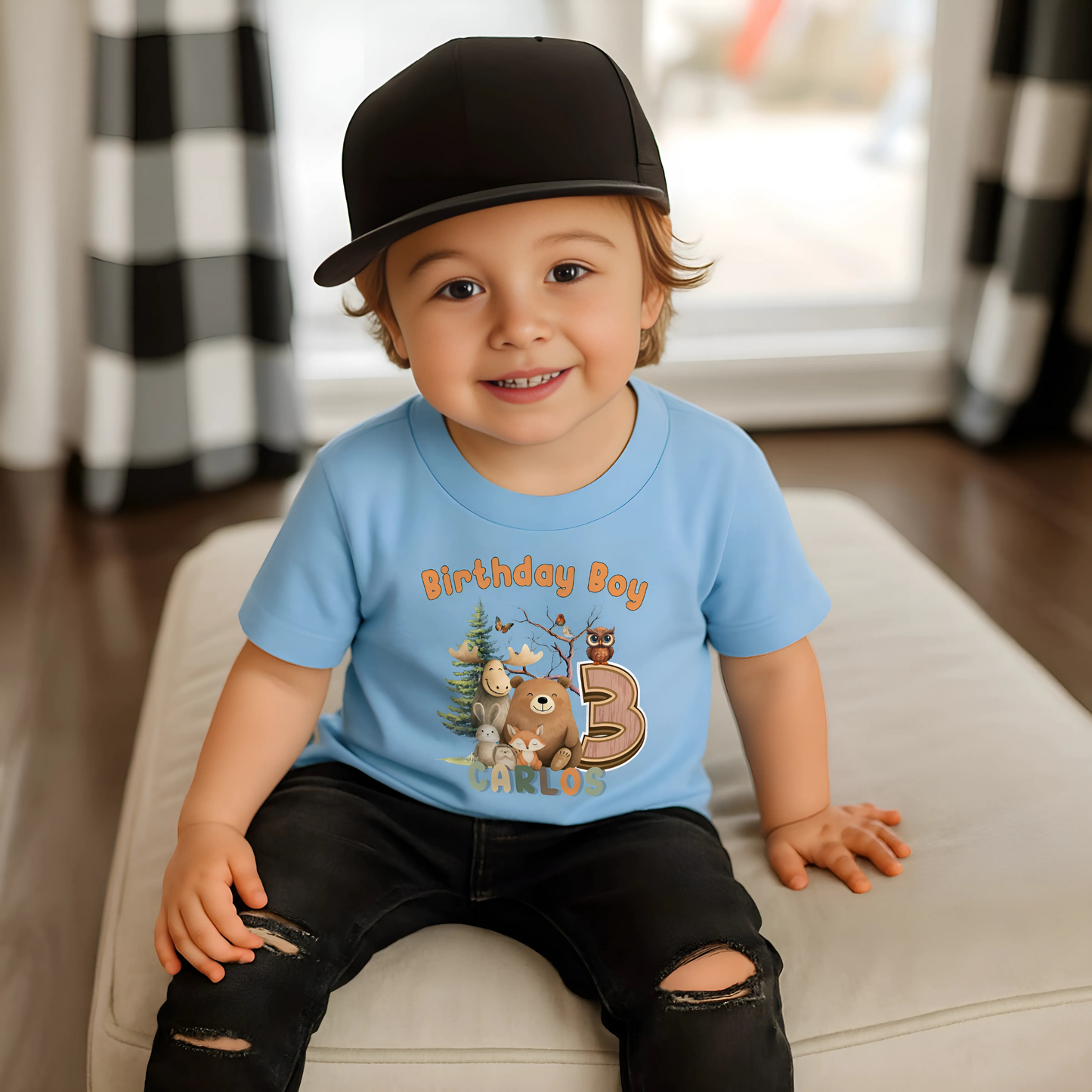 Woodland animal birthday t-shirt: A children's birthday t-shirt featuring a woodland animal theme. The shirt displays a forest scene with a playful fox, a curious bear, and a gentle bear, surrounded by lush greenery. The design uses earthy tones and vibrant greens to create a natural look. At the top, the words “Birthday Boy” are printed, with space for a personalized name underneath. Made from soft, high-quality fabric, it’s designed for comfort and durability.