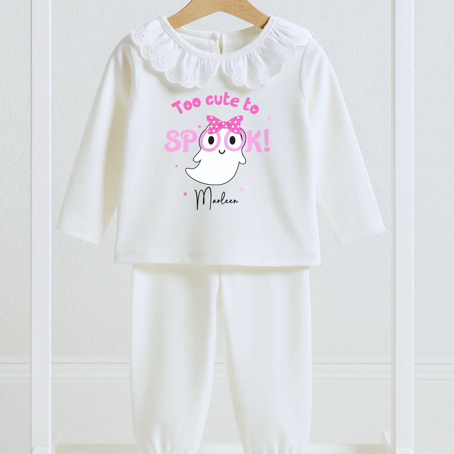 Personalised Halloween pyjamas for girls with “Too Cute to Spook” ghost design on white frill set.