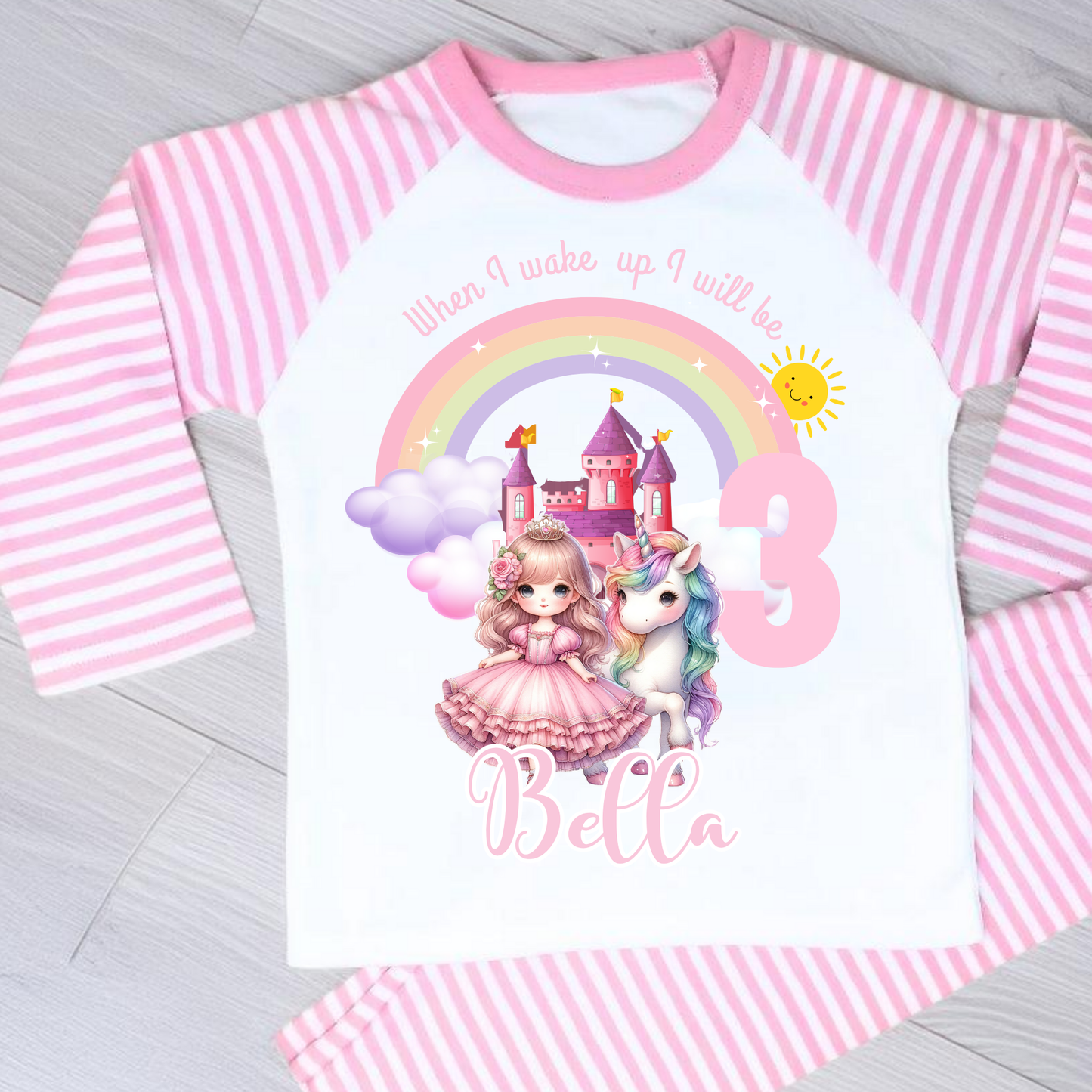 Princess Birthday Pyjamas: A pink and white long-sleeved pyjama set with a rainbow, castle, unicorn, and a princess in a pink dress. The top has the text 'When I wake up I will be with age and name. It will be a perfect personalised gift for a girls birthday to compliment a princess unicorn birthday party.