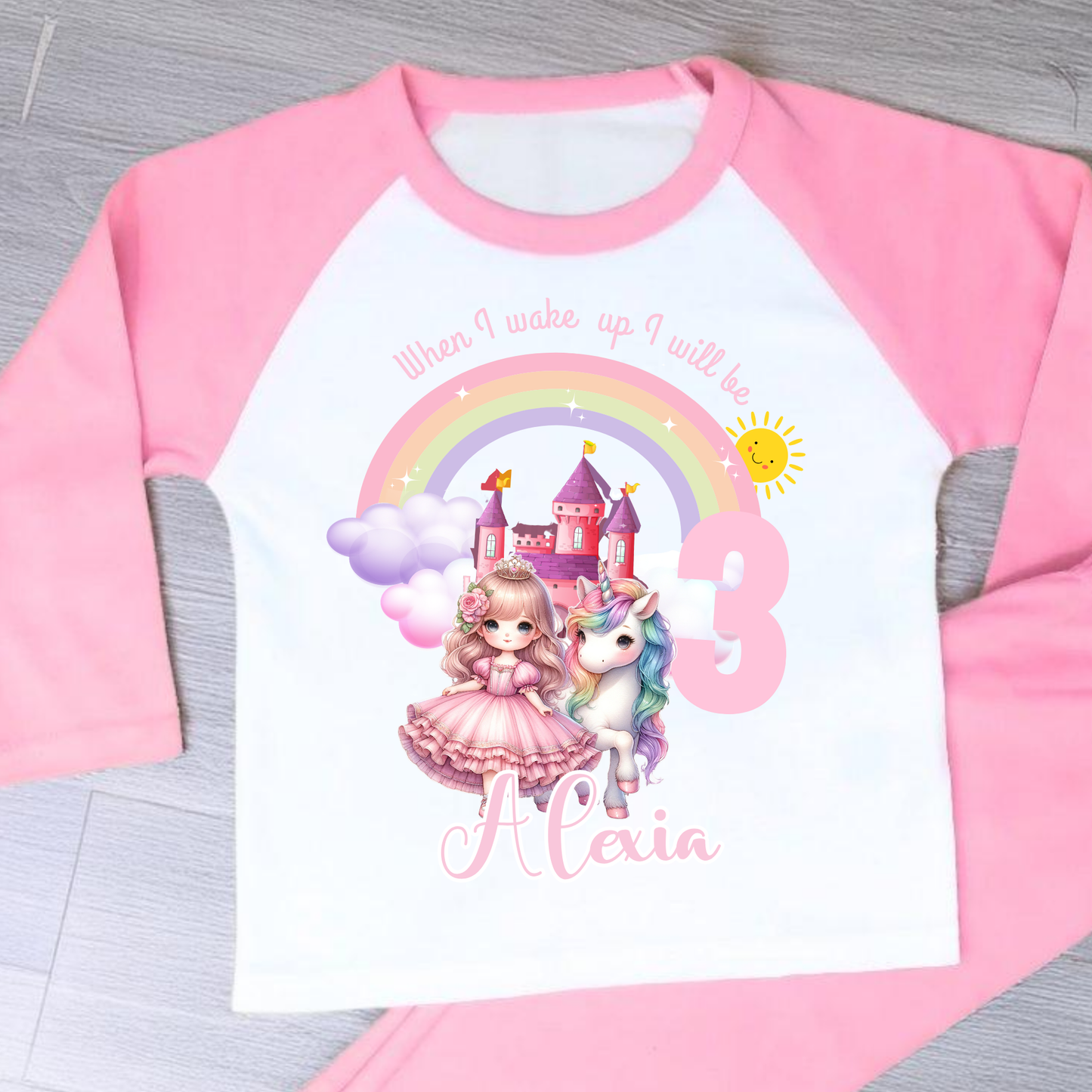 Princess Birthday Pyjamas: A pink and white long-sleeved pyjama set with a rainbow, castle, unicorn, and a princess in a pink dress. The top has the text 'When I wake up I will be with age and name. It will be a perfect personalised gift for a girls birthday to compliment a princess unicorn birthday party.