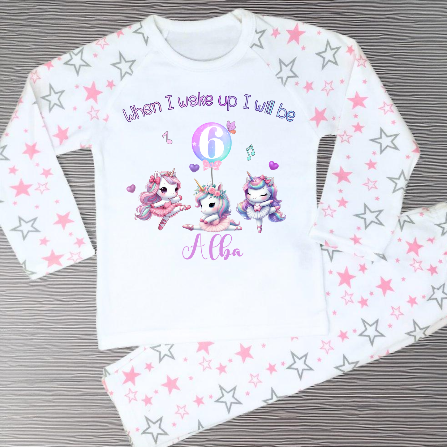An adorable set of pastel pink and lilac birthday pyjamas, featuring a whimsical dancing unicorn design. Perfect for little girls who love unicorns, this personalised ‘When I Wake Up’ toddler set makes a magical gift for your little dancer. Personalised Birthday pyjamas, girls birthday gift, birthday outfit, unicorn present, personalised unicorn birthday ideas, uncicorn birthday party ideas