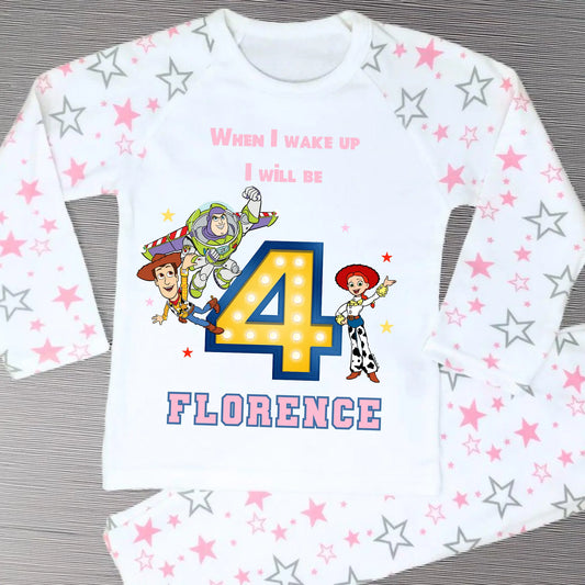 Toy Story birthday pyjamas for girls with custom name and age, featuring Buzz Lightyear, Woody, and Jessie, bold birthday number in Toy Story colours, and name printed underneath, soft and comfy sleepwear set for birthday mornings