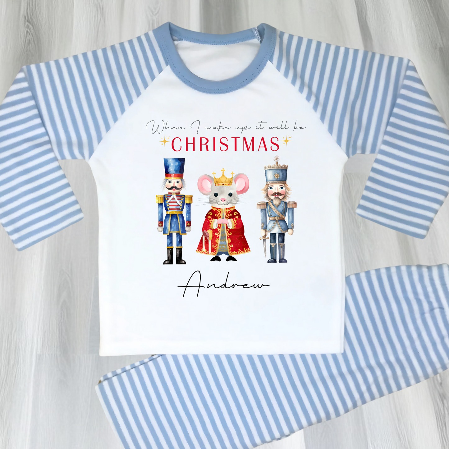 Nutcracker christmas pyjamas, A set of personalised boys Nutcracker-themed Christmas pyjamas, featuring the festive phrase “When I Wake Up It Will Be Christmas.” These cosy christmas pyjamas are adorned with whimsical Nutcracker illustrations, perfect for adding a touch of magic to a child's Christmas Eve: personalized, boys, Nutcracker, Christmas pyjamas, festive, holiday, cosy, magical.