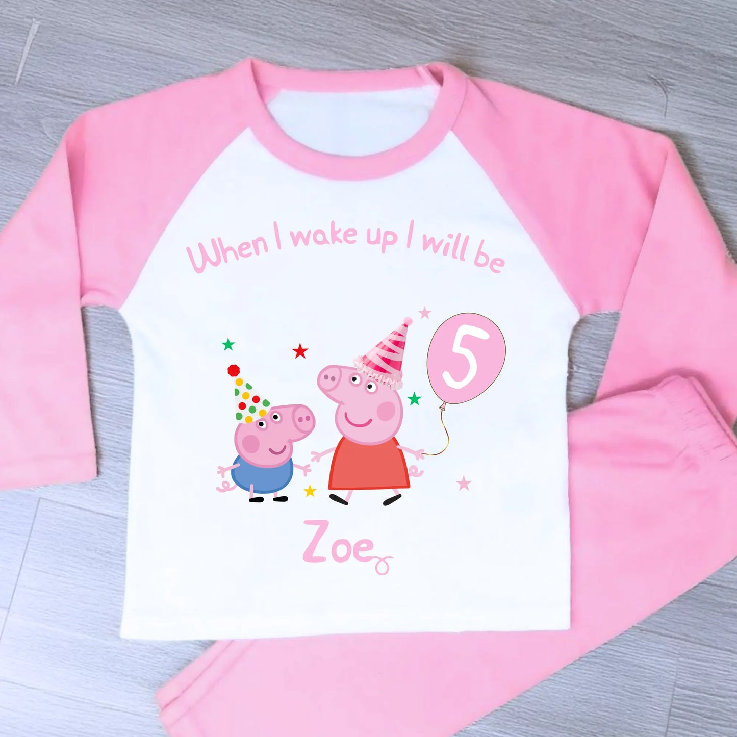 Girls Personalised Peppa and George Pig Birthday Pyjamas, Peppa Pig Personalised Pyjamas, When I wake Up I'll Be Pj's, Girls Peppa Pig Pjs, Peppa Pig Birthday Gift, Name Pyjamas, Happy Birthday Pjs, Pink and white long-sleeve shirt with Peppa Pig design and text on a gray surface