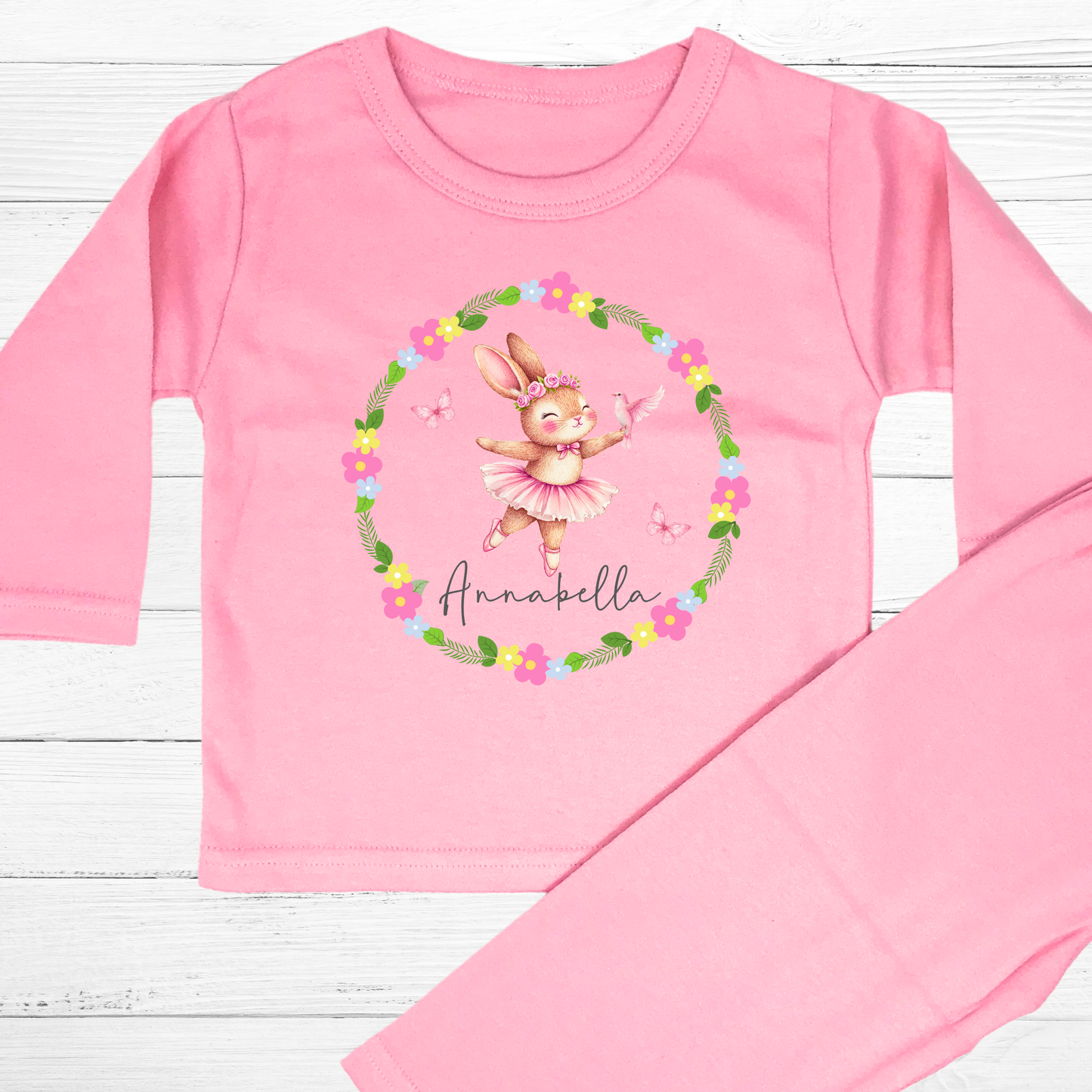 Personalised baby pyjamas: A set of personalised baby girl clothes featuring a dusky pink ballet bunny surrounded by a floral wreath. The pyjamas are designed for ages 0-2 years and includes flower-themed pyjamas. It can be customised with a name, making it a thoughtful new baby gift: Personalised Baby Girls Dusky Pink Ballet Bunny Floral Wreath 0-2 Years, New Baby Gift with Name, Flower Pyjamas, Custom Baby Girl Clothes