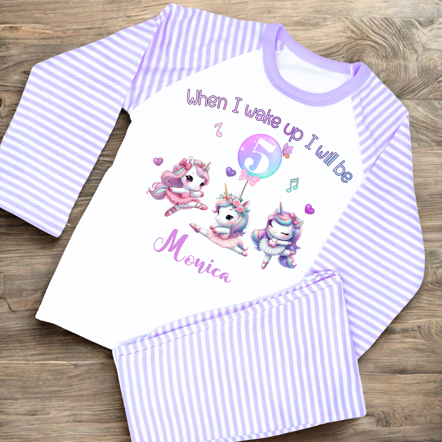 An adorable set of pastel pink and lilac birthday pyjamas, featuring a whimsical dancing unicorn design. Perfect for little girls who love unicorns, this personalised ‘When I Wake Up’ toddler set makes a magical gift for your little dancer. Personalised Birthday pyjamas, girls birthday gift, birthday outfit, unicorn present, personalised unicorn birthday ideas, uncicorn birthday party ideas