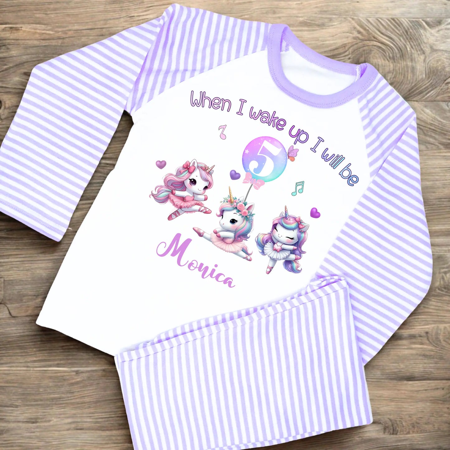 An adorable set of pastel pink and lilac birthday pyjamas, featuring a whimsical dancing unicorn design. Perfect for little girls who love unicorns, this personalised ‘When I Wake Up’ toddler set makes a magical gift for your little dancer. Personalised Birthday pyjamas, girls birthday gift, birthday outfit, unicorn present, personalised unicorn birthday ideas, uncicorn birthday party ideas