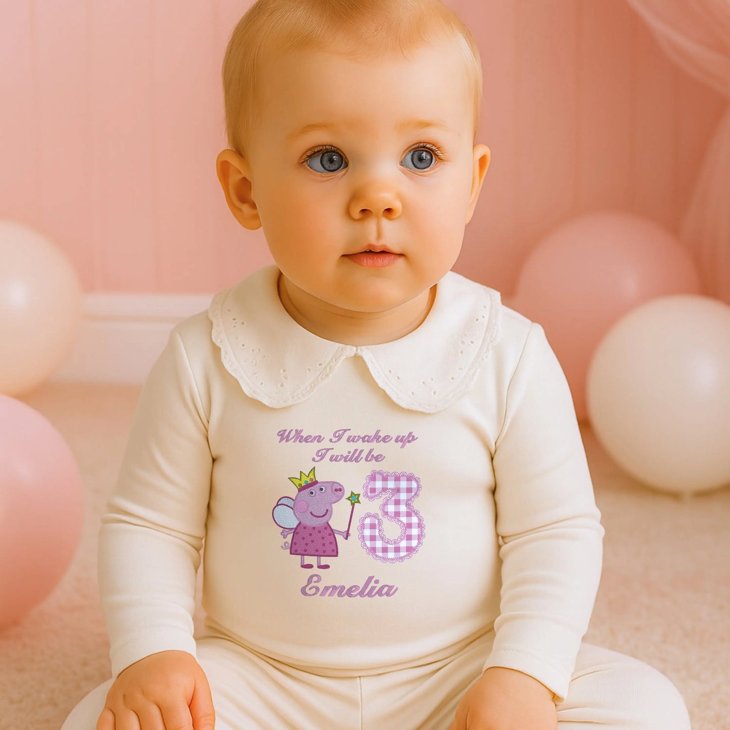 Embroidered Peppa Pig Pyjamas: A child wearing white frilly pyjamas with a Peppa Pig design with child's name under. Perfect for Christmas and birthday gifting.