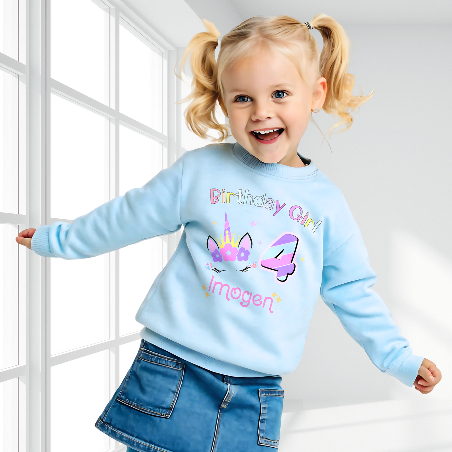 Unicorn Birthday Sweatshirt, A personalised birthday jumper for girls, featuring a pink and purple unicorn design. The sweatshirt is customisable with the child's name and age, making it a perfect birthday gift. The vibrant colours and whimsical unicorn imagery make it an ideal choice for a toddler celebrating her special day.