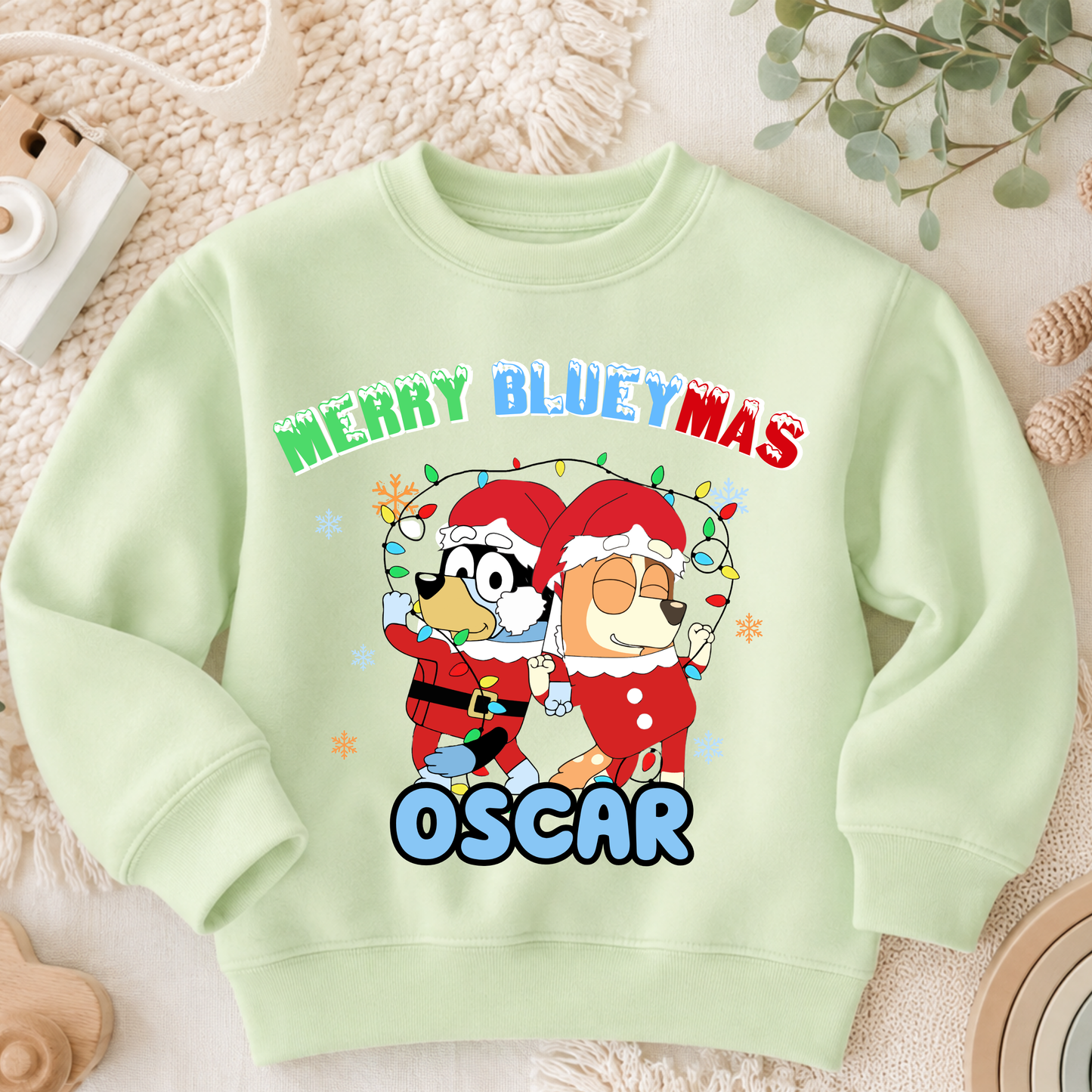 Personalised Christmas Jumper for kids featuring a festive Merry Blueymas design with Bluey and Bingo, personalised with your child's name.