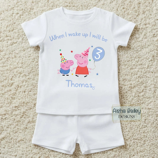 Personalised Peppa and George Pig Birthday Pyjamas for Boys with custom name and age, featuring birthday number on white short set