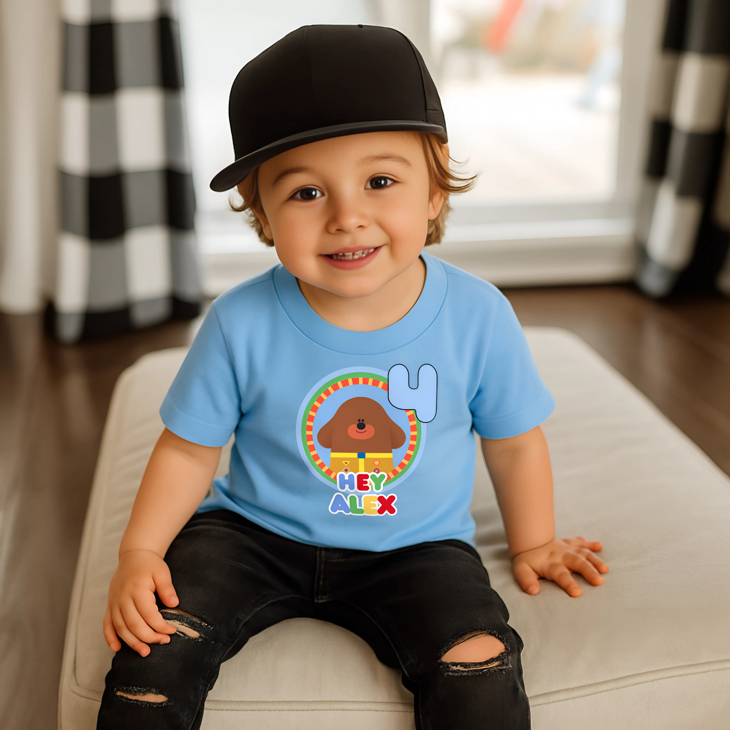 Hey Duggee Badge Birthday T-shirt: A lively and vibrant birthday t-shirt featuring the beloved character Hey Duggee, perfect for a child's special day. The shirt is customisable with the child's name and age, making it a personal keepsake. Made from 100% cotton, it promises comfort and durability for active play. The design's bright colours and the iconic Hey Duggee badge add a delightful touch that reflects the child's unique personality and love for the popular children's series.