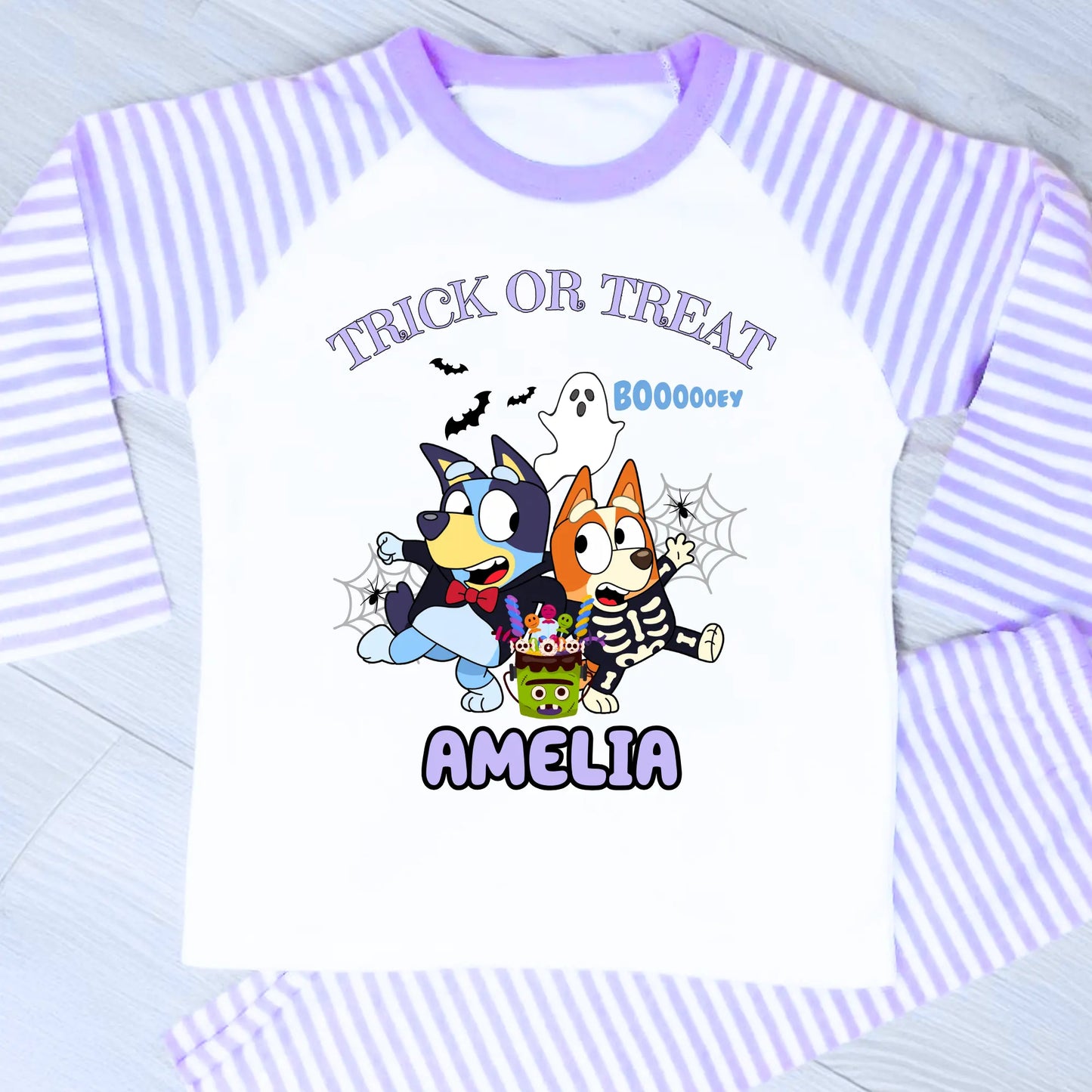 Girls personalised Bluey and Bingo Halloween pyjamas with name print and cute spooky design