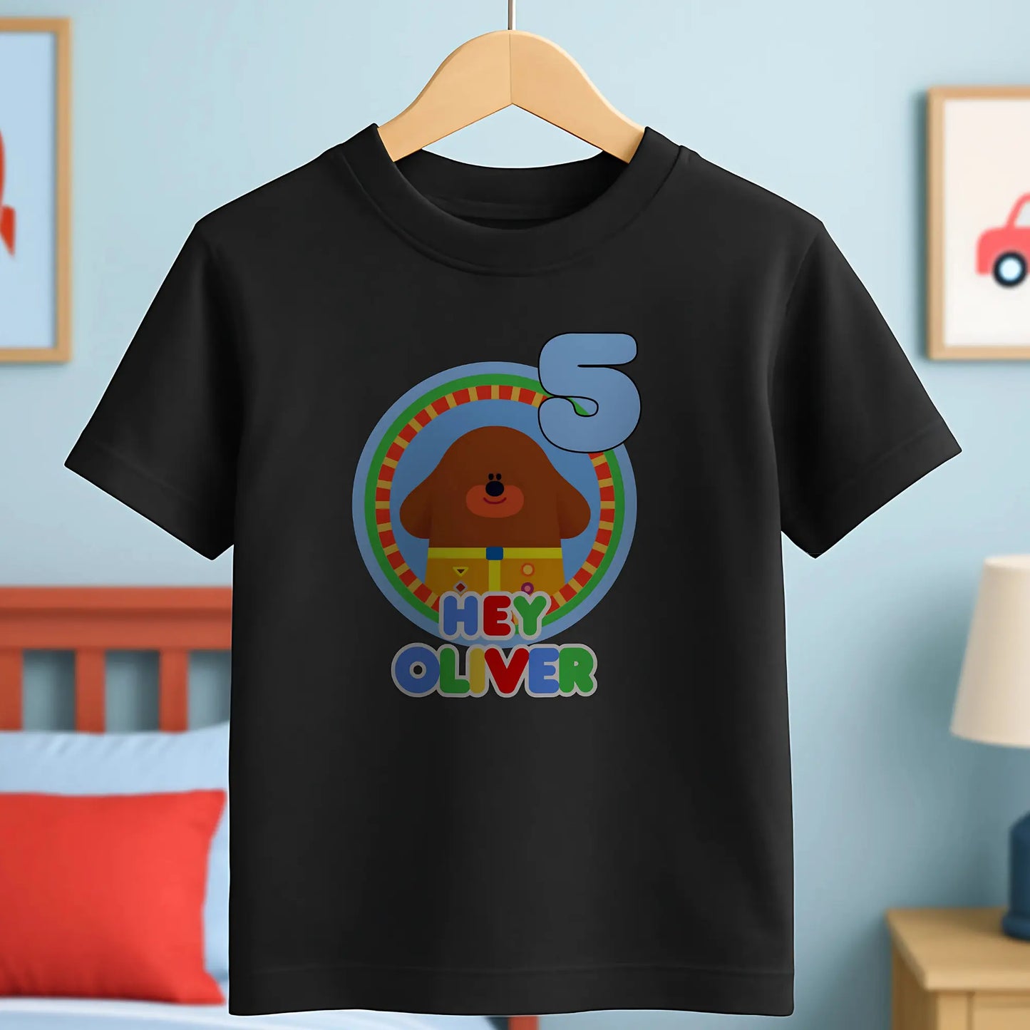 Hey Duggee Badge Birthday T-shirt: A lively and vibrant birthday t-shirt featuring the beloved character Hey Duggee, perfect for a child's special day. The shirt is customisable with the child's name and age, making it a personal keepsake. Made from 100% cotton, it promises comfort and durability for active play. The design's bright colours and the iconic Hey Duggee badge add a delightful touch that reflects the child's unique personality and love for the popular children's series.