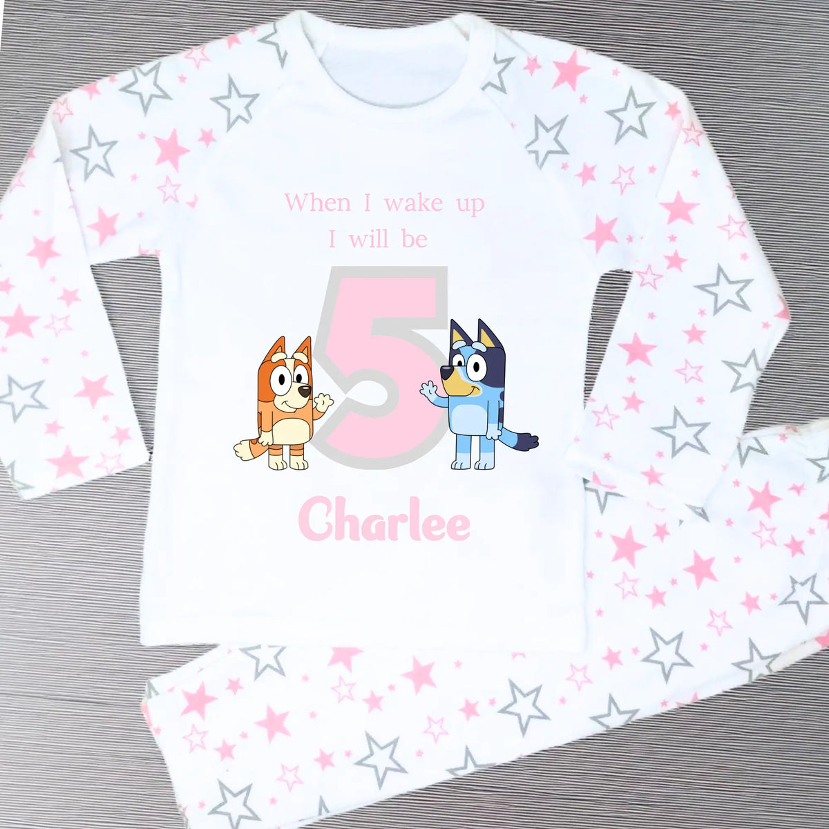 Girls Personalised Bluey Birthday Pyjamas with Bluey and Bingo, customised with child's name and birthday age for a special birthday celebration.