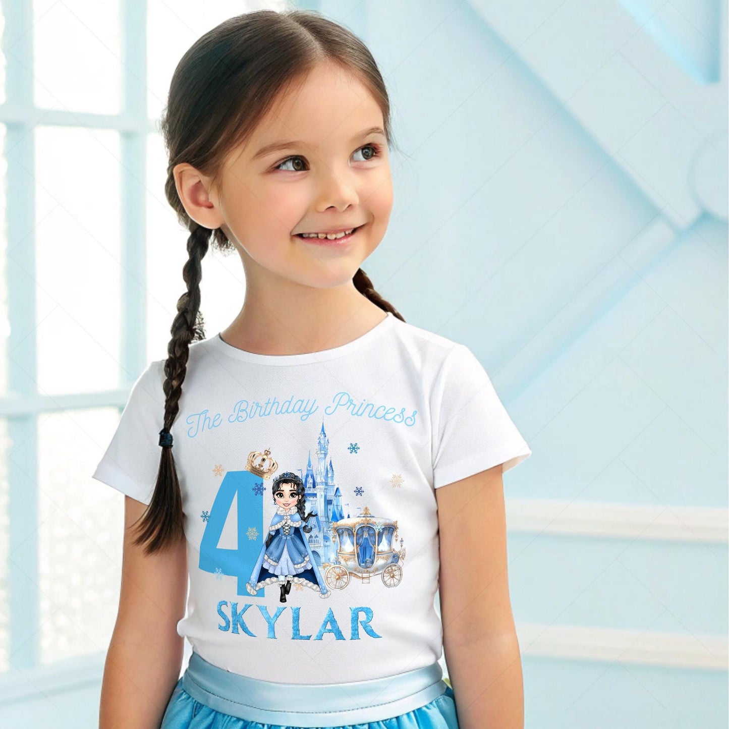 A charming, personalized girls' birthday T-shirt designed for a princess-themed celebration. The design is a soft blue, reminiscent of an ice princess's gown, crafted from 100% cotton for comfort. Its front features a delightful illustration of a snow princess, surrounded by delicate snowflakes. The design is completed with customizable elements, displaying a name and age in elegant, white script. This tee is perfect for creating a magical birthday experience for any young princess.