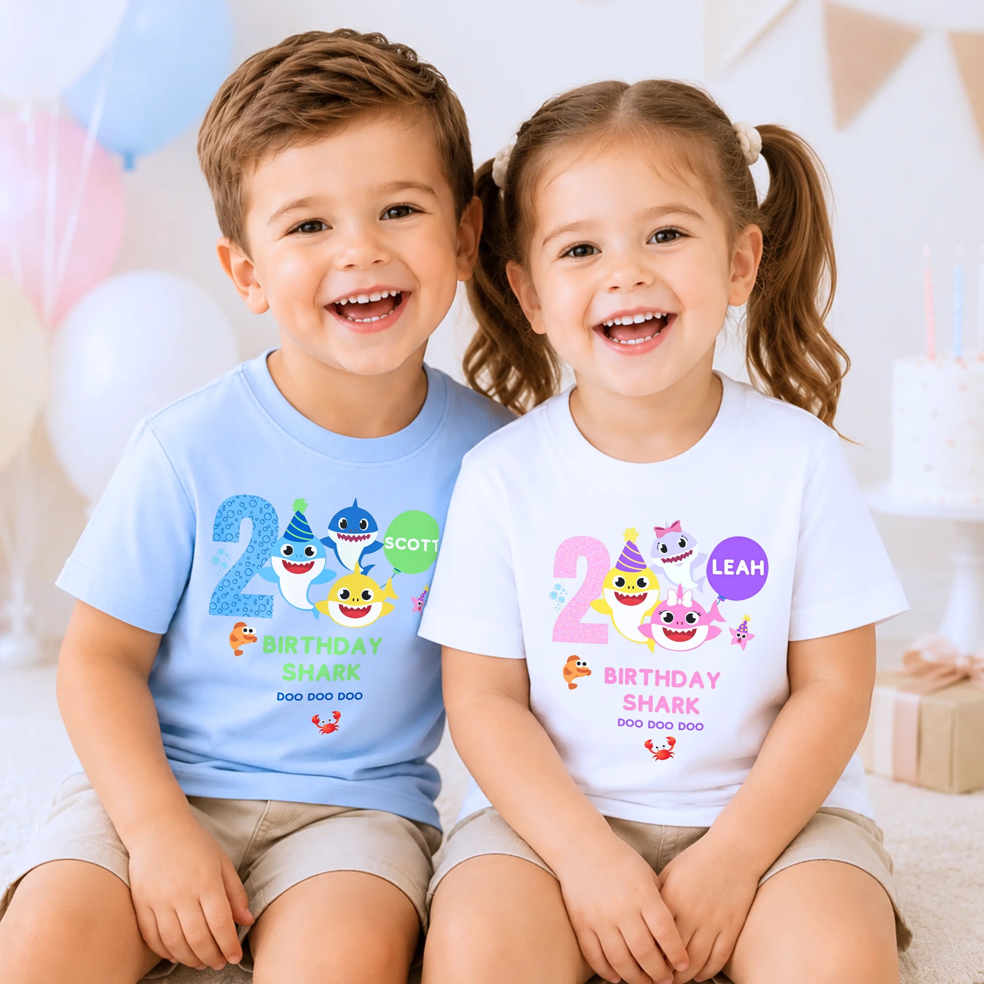 Two smiling children wearing plain birthday t-shirts, showcasing personalised kids' birthday clothing for boys and girls.