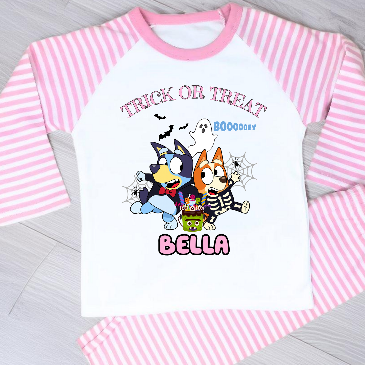 Girls personalised Bluey and Bingo Halloween pyjamas with name print and cute spooky design