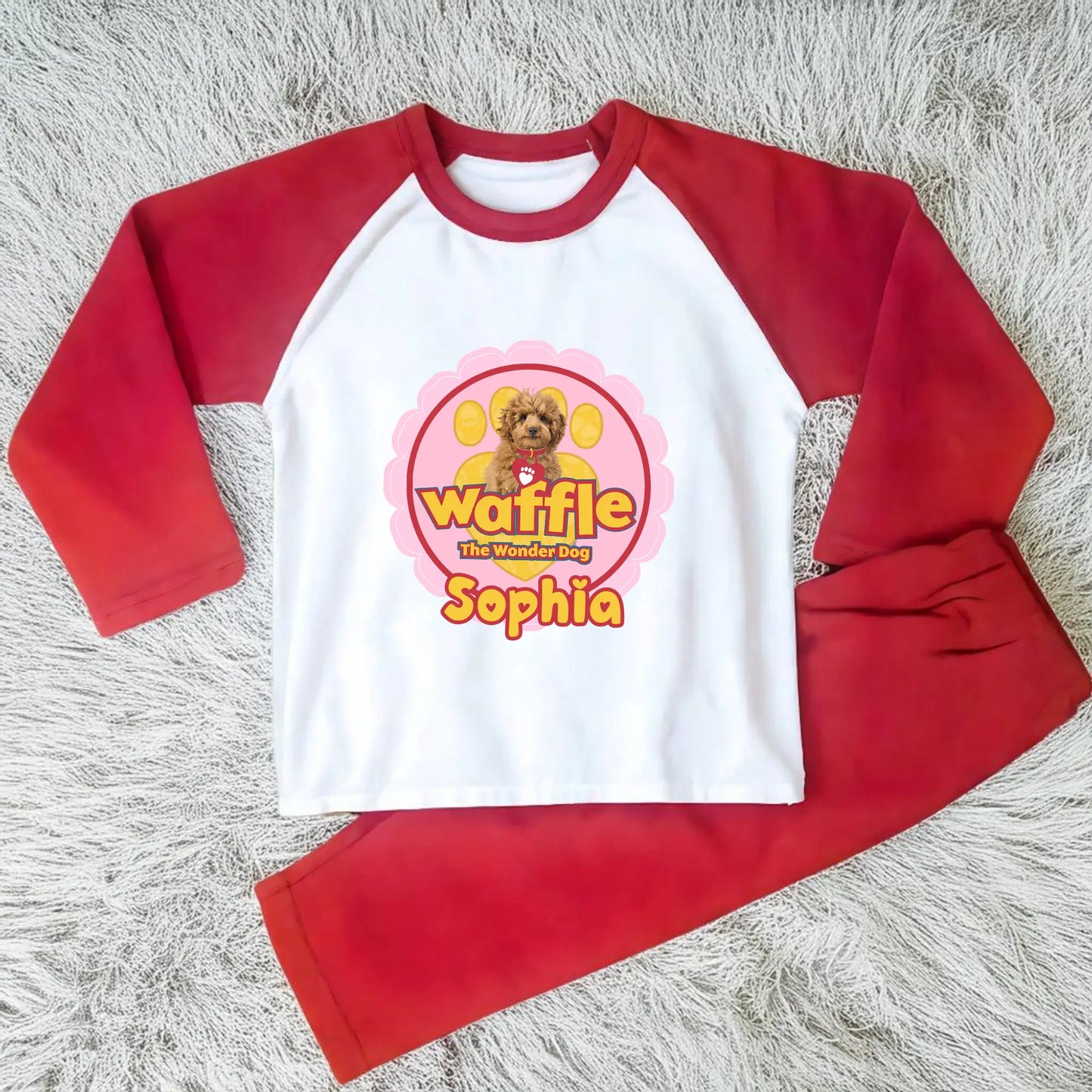 Personalised Waffle Pyjamas: Children's long-sleeve pyjamas with personalised Waffle the Wonder Dog design on a star-patterned background, custom name pyjamas