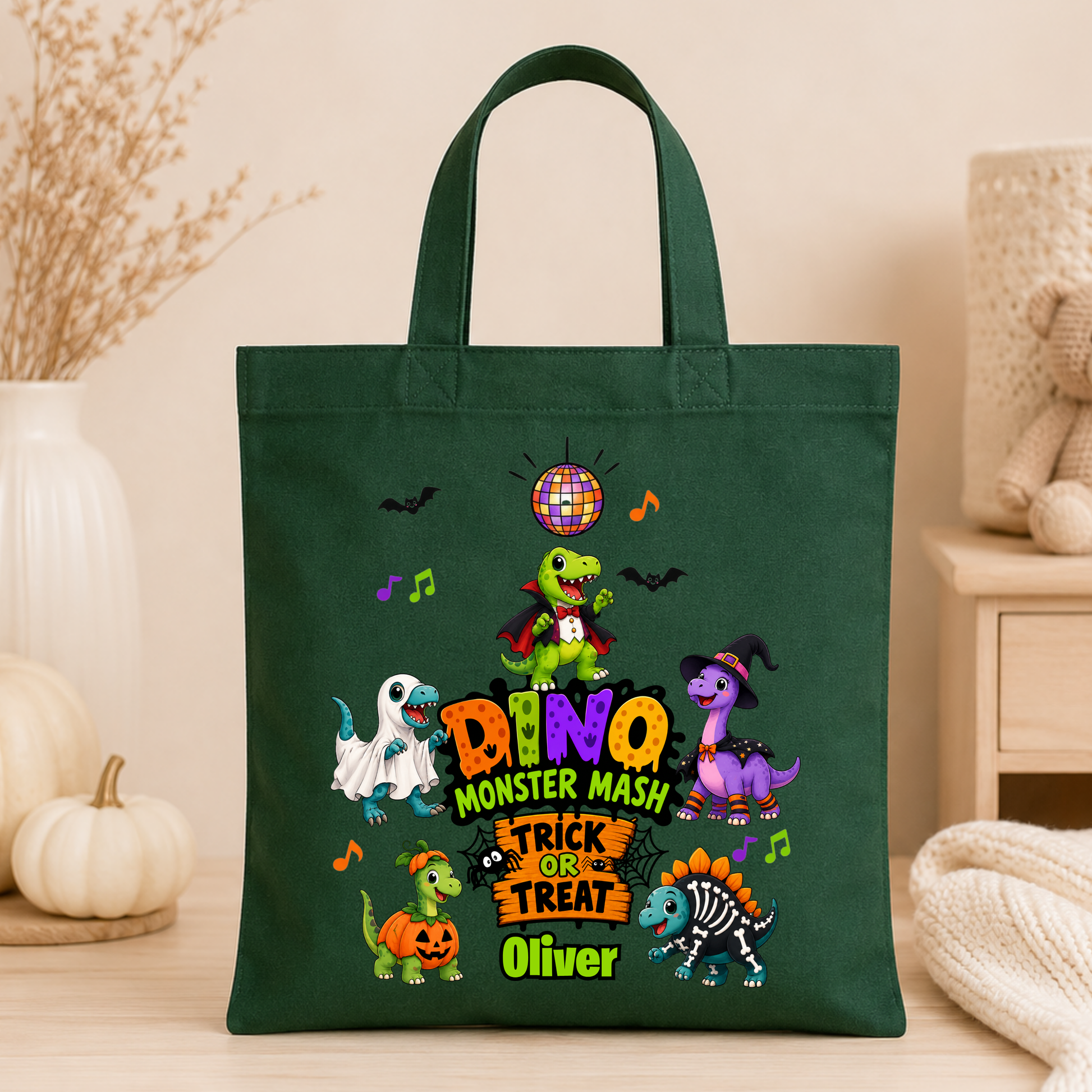 Personalised Halloween Bag with child's name, colourful Halloween dinosaurs and trick or treat design, available in green, pink and white.