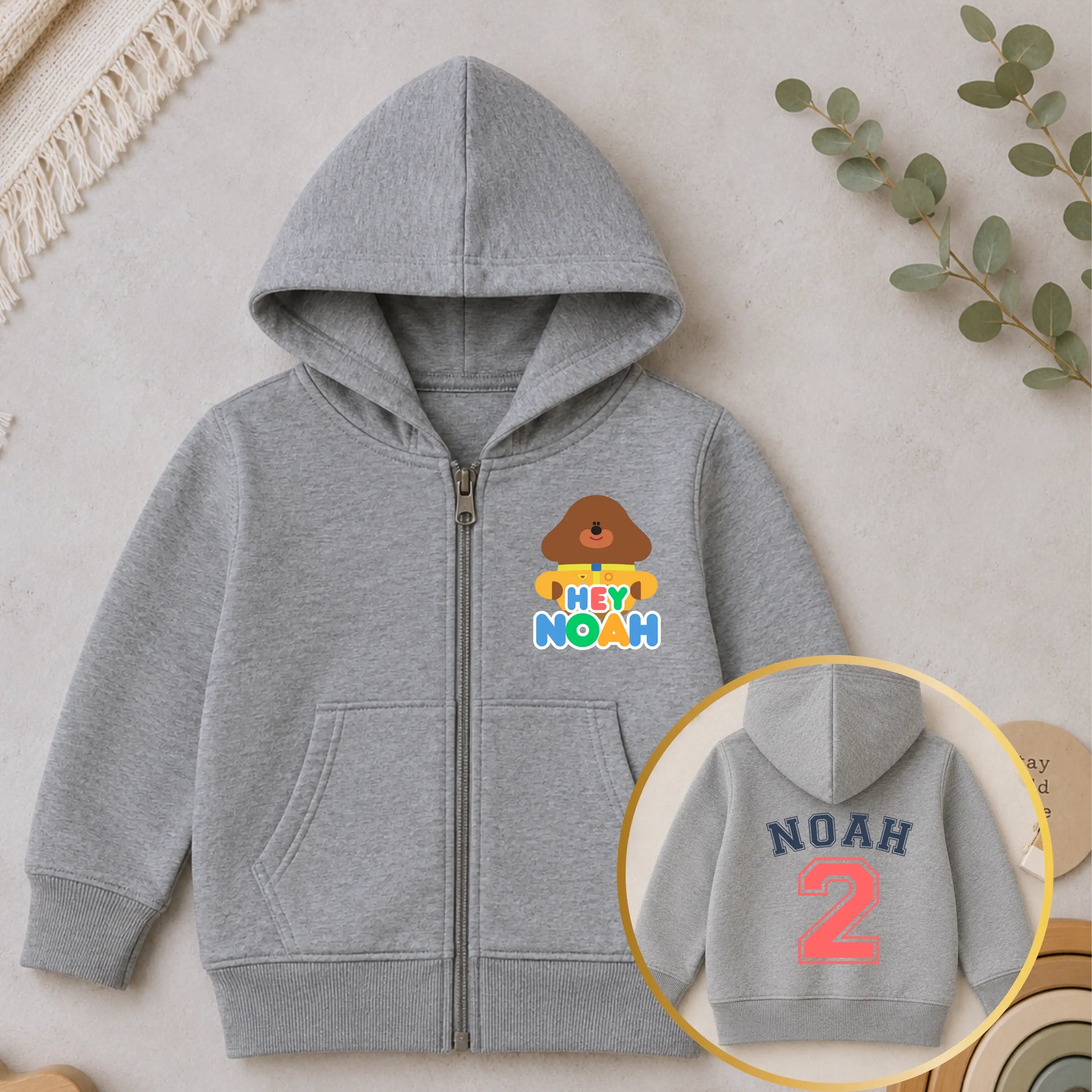 Personalised Hey Duggee birthday hoodie for boys with custom name and number back print on white zip-up childrens hoodie - aishabaileydesigns